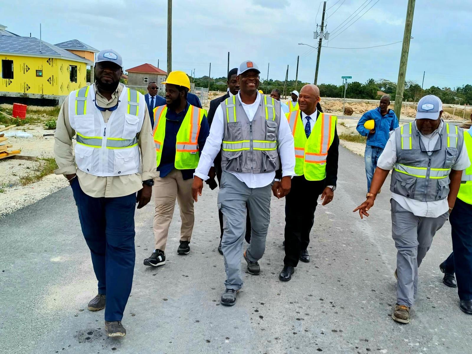 Ministry officials touring an active housing site
