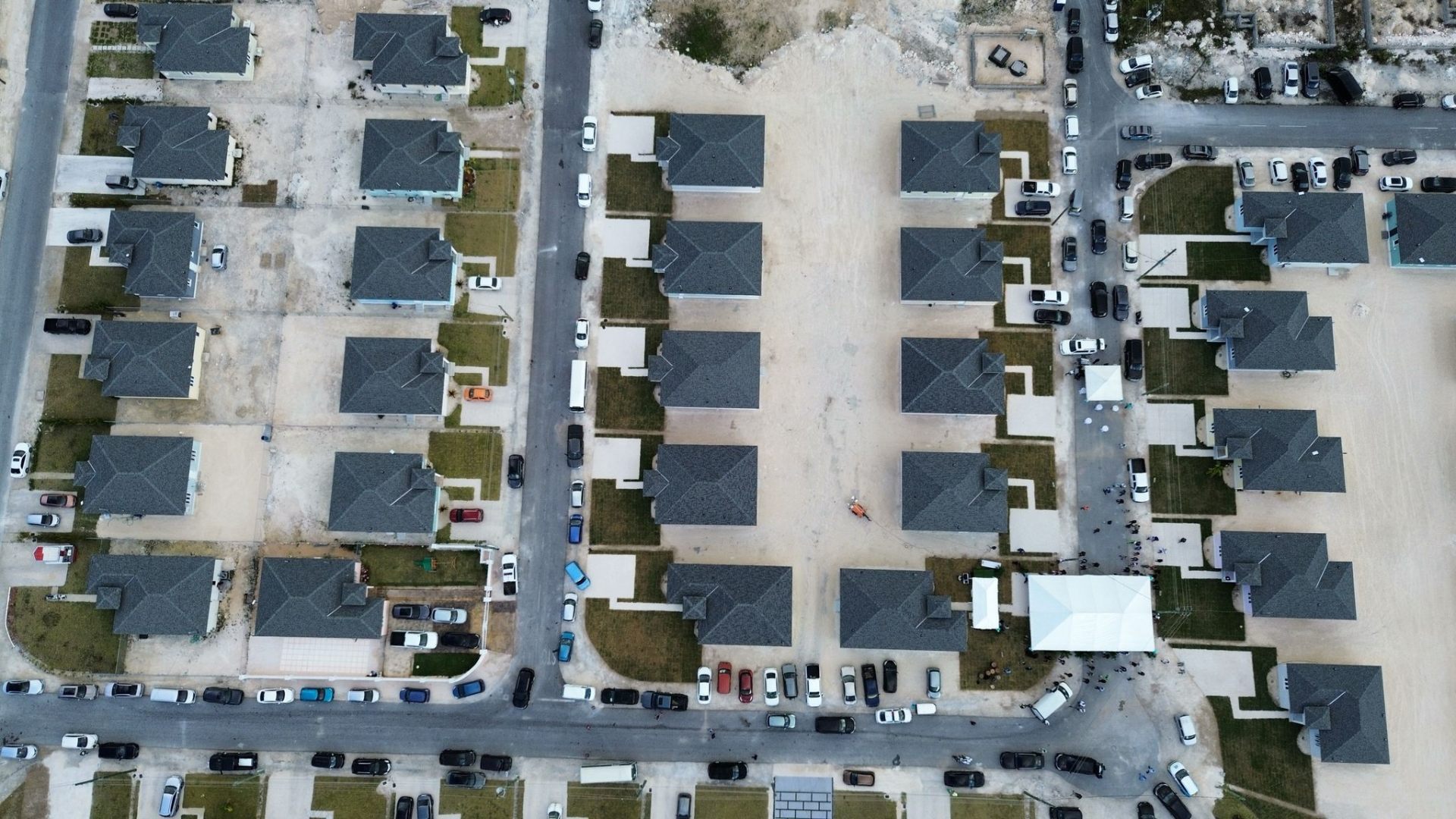 Families walking through a planned government subdivision